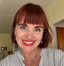 Having lunch with the Swedish/Finnish relatives in the market place in  Vassa, Finland 1958. Mom, in the chair with the red backing is wearing a  polka dot dress.