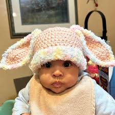 Adorable baby girl in handmade crochet piece