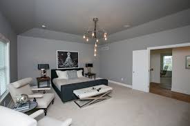 The walls are gray bricks and surround a neutral colored headboard. X Bench Transitional Bedroom Bia Parade Of Homes