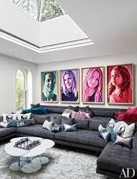Points of interest ● football themed home theater ● framed jerseys on gray walls ● 2 new york giants logo upholstered points of interest ● blue leather theater seats ● arche niches with movie posters ● black arched double door with pewter. 16 Home Theater Design Ideas For The Most Luxurious Movie Nights Architectural Digest
