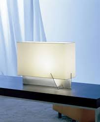 This product features a brushed steel base and a fabric shade. Table Lamp Nairobi Carpyen Metal Cotton Contemporary