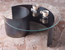 Or perhaps you've been considering options for something fresh and new, like upcycling that quirky object you found recently? Contemporary Coffee Table Wave Kin Company Glass Steel Base Round