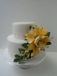 Two Tier Wedding Cake With Bright Yellow Sugar Flower Spray Alstroemeria And Mimosa Cake Sugar Flowers Tiered Wedding Cake