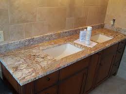 An ogee edge ties into the decorative details of the cabinetry. Typhoon Bordeaux Granite 61 Details Projects Slabs Classic Marble Stone Hoagland Indiana Classic Marble Stone