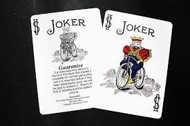 The last time we've talked playing cards, we've discussed the interesting reason why ace of spades is always the most decorated card in the deck. Hd Wallpaper Two Joker Playing Cards Deck Bicycle Magic Cards Text Close Up Wallpaper Flare