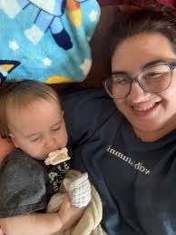 Alumni shares cozy moment with son