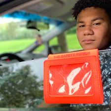 Student's orange 'safety pouch' invention aims to make traffic stops  easier, less dangerous