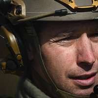 US Marine Corps (USMC) Sergeant (SGT) Brian Rice, Squad Leader,  Lima/Company, 3rd Battalion, 23rd Marine Regiment, takes count as Marines  board a KC-130 Hercules aircraft assigned to Marine Aerial Refueler  Transport Squadron