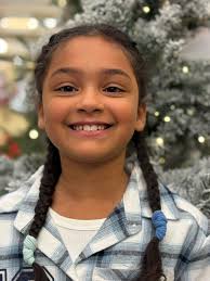 Christmas photo of girl and rocking horse