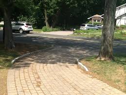 Adding a neat row of belgian block stones to each side of an asphalt driveway will boost its curb appeal while also providing a clear visual aid as you back out or pull in. Remove Belgian Blocks On Driveway Curb Doityourself Com Community Forums