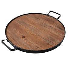 Its gentle shape, with round corners and small rectangular handles, is in metal. New Design Farmhouse Wine Barrel Top Extra Large Round Wood Serving Tray Buy Wholesale Custom Unique Circle Solid Wooden Platter With Iron Handles Multiple Occasions Removeable Bar Drinks Platters For Cocktail Station Vintage