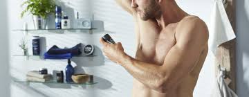 Man trimming his armpit with an electric trimmer. How To Stop Armpit Smell Body Odour Treatment Nivea Men