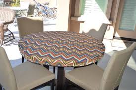 Some are mainly ornamental coverings, which may also help protect the table from scratches and stains. Round Fitted Tablecloth Made With Outdoor By Brittaleighdesigns I Love This Bold Outdoor Fabric Made Fitted Tablecloths Outdoor Fabric Durable Outdoor Fabric
