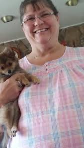 Hello everyone. Is paw size an indicator of how big my girl is going to be.  She's 15 months old and 13.5lbs all fluff and bones (maybe a little chub  too). She's