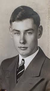 Who is the young man in this family photo?