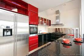 Red kitchen cabinets with black countertops. Pin On Red Kitchens