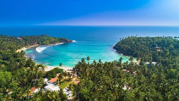 Hiriketiya Beach hidden horseshoe bay surf yoga retreat east Mirissa south coast Sri Lanka