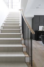 Black And White Herringbone Stair Runner White And Black Herringbone Staircase Runner Accents Blond Wood Treads Complemented With A Blond Wood Hand Staircase Runner Staircase Design Staircase Handrail