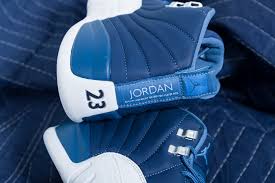 In addition they feature silver on the top two metal eyelets while white leather runs across the mudguard. Nike Air Jordan 12 Retro Stone Blue Up There