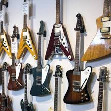 I really want to be able to hang my guitars up on the wall, but drilling wall mounts into the drywall is not possible and i have no idea where the studs are (or if they in a good placement to hang things anyway). String Swing Guitar Wall Mounts And Instrument Displays