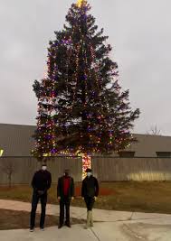 Mayor Sheldon Neeley lights holiday trees at Flint Development Center,  Flint City Hall