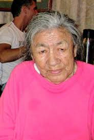 I was hoping someone could straighten and clean this photo up. My dad is  stooping down right behind the guy in the helmet in the front (looking at  the pix he is