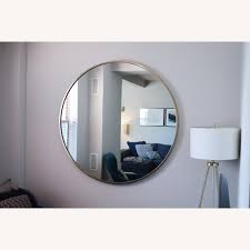 It comes in a variety of finishes so that you can pick the color that complements your home… West Elm Gold Frame Oversized 48 Round Mirror Aptdeco