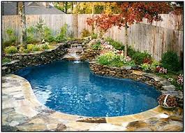 Pool with small waterfall swimming pool waterfalls pictures swimming pool waterfalls water features swimming pool waterfalls construction inground pools. Outdoor Swimming Pool With Waterfall Backyard Pool Landscaping Small Pool Design Swimming Pools Backyard