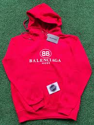 The blue creation is designed with a zip closure, long sleeves, and embroidered logo details on t. Balenciaga Hoodie Exclusive Sneakers Sa