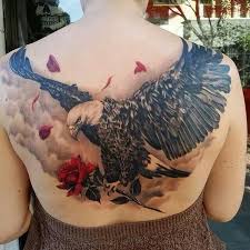 Eagle With A Rose Eagle Tattoos Eagle Tattoo Bald Eagle Tattoos