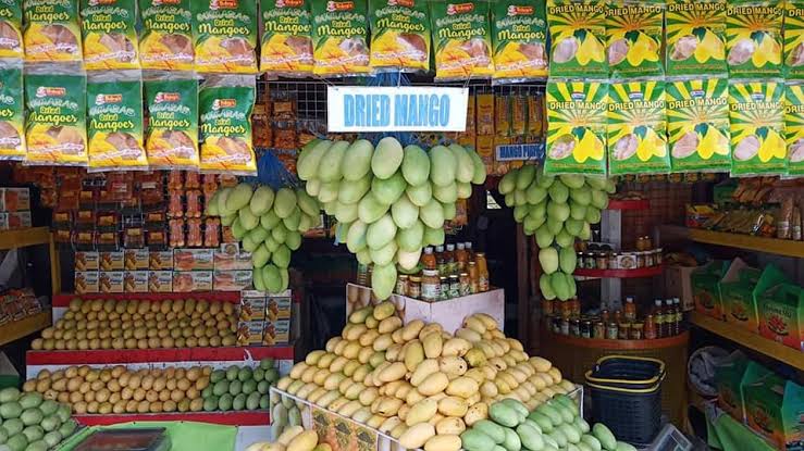 Image result for mangoes in stand"