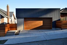 Mesmerizing Contemporary Garage Doors Tesla For Simple Home Design Ideas Gray Paint Wall Mixed With Wooden Door Garage Design Garage Doors Modern Garage Doors