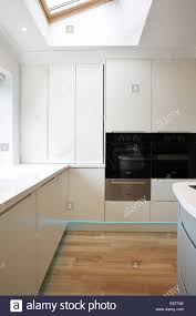 a modern white kitchen inside a home in