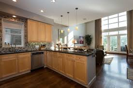 Modern Open Concept Kitchen With Light Wood Cabinets Black Granite Countertops Pendant Lighting Outdoor Kitchen Countertops Light Wood Cabinets Countertops