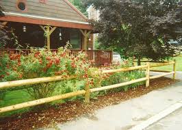 The split rail, or post and rail, fence is essentially a rustic version of a post and board fence style and is similarly a good choice for a decorative accent, for delineating areas, or for marking boundaries without creating a solid visual barrier. Post And Rail Wood Fencing Contractor Boston Ma Ranch Rail Equestrian Fence