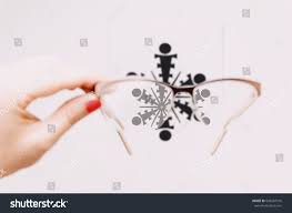 womans hand holding eyeglasses front tibetan stock photo