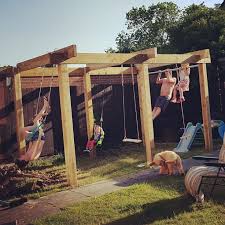 Our Garden Pergola Climbing Frame With Swings Monkey Bars Trapeze Bars And A Pull Up Bar Just Need To Grow Some Backyard Play Backyard Playground Pergola
