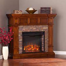 They're perfect if you want something that gives the aesthetic of a cozy fire with a little extra heat. Amesbury 45 75 In W Faux Stone Corner Electric Fireplace In Buckeye Oak Hd90565 The Home Depot