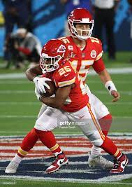 Patrick Mahomes Of The Kansas City Chiefs Hands Off To Clyde In 2021 Kansas City Chiefs Kansas City Kansas