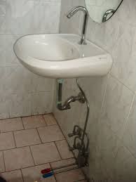 sink, commercial toilet, bathroom sink