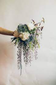 14 Beautifully Untraditional Wedding Bouquets Domino Wildflower Wedding Bouquet Wedding Flower Guide Wisteria Wedding