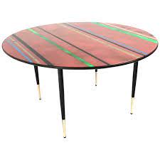 For all those vintage souls, this coffee table is delightfully chaotic and a warm hug of comfort for your home. Midcentury Round Coffee Table With A Red Back Painted Glass Top Italy 1950s For Sale At 1stdibs
