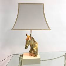 And, of course, as with any treasured objects, a book lover's volumes were suddenly worthy of a luxurious display — enter the bookcase. Vintage Brass Horse Head Table Lamp 1970s 89683