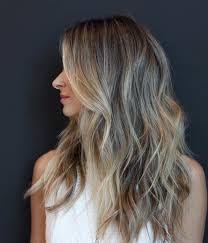 Subtle layers give long hair some definition without altering the shape of the hair, and they look great even when growing out. Subtle Layering