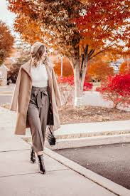 Camel colored wide leg trousers with pockets and buttons. Brown Plaid Pants For A Sophisticated Outfit Wide Leg Plaid Pants Brown Wide Leg Pants White Turtle White Turtleneck Outfit Plaid Pants Outfits With Hats