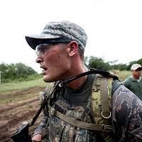 Silhouette of US Air Force (USAF) Colonel (COL) Joe Mudd, Commander, 36th  Air Base Wing (ABW), speaks at a ground breaking ceremony for a new  Security Forces operational building at Andersen Air