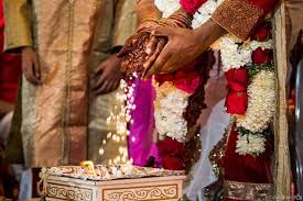 The freight elevator at this rooftop wedding carried the groom, rodney, up for an unforgettable first look moment. Indian Wedding Nicole Chan Photography