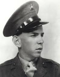 USAAF Major Daniel Riva, Squadron Commander of the 385th Bomb Group,  instructs Staff Sergeant John Leary, a waist gunner