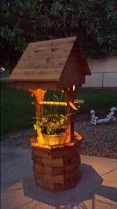 Wishing well lawn ornaments handcrafted designs. Diy Illuminated Wishing Well Planter Wishing Well Garden Diy Wishing Wells Backyard Decor