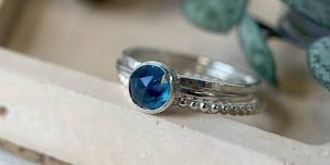 Stacking gemstone and sterling silver rings.